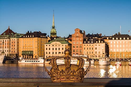 Sweden-Stockholm-Gamla Stan-Old Town-old town skyline and crown on the Skeppsholmsbron bridge Architecture Print